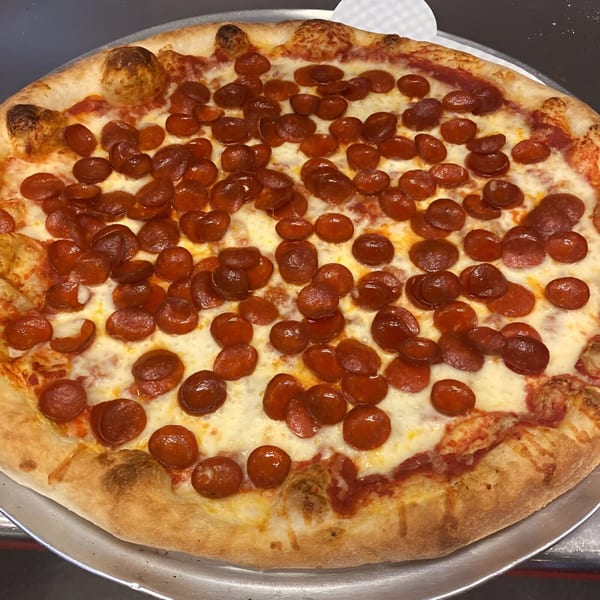 A freshly baked Biaggio Pizzeria pepperoni pizza with melted cheese and a golden crust.