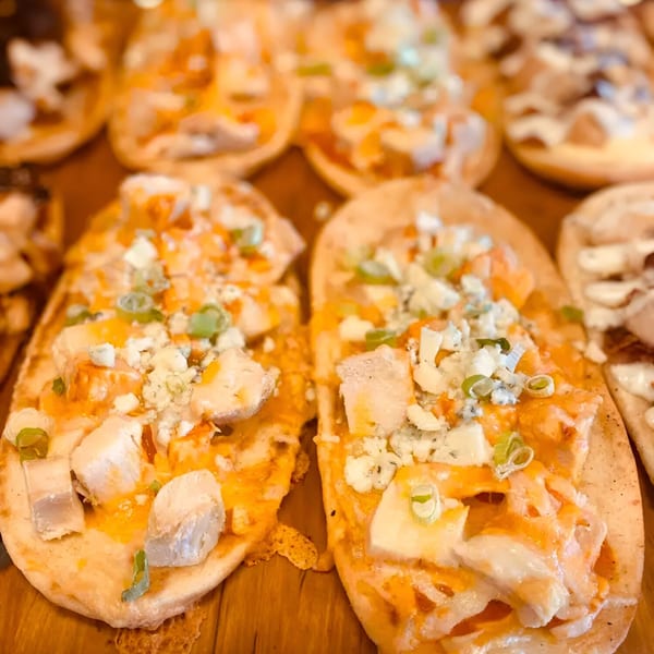 Close-up of Biaggio Pizzeria's buffalo chicken flatbreads with blue cheese and scallions.